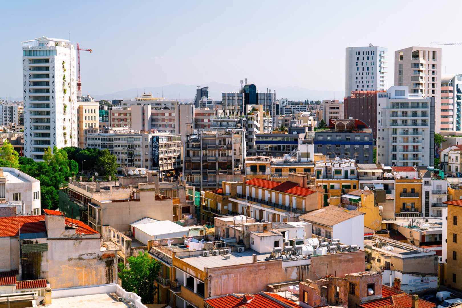 Cityscape with diverse buildings under a clear sky.